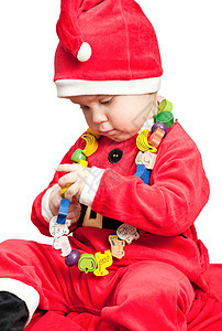 穿着圣诞老人西装的婴儿 木制的 美丽的 帽子 孩子 传统的图片