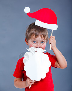 戴着圣诞老人帽子的小男孩 乐趣 微笑图片