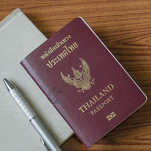 泰籍护照 数据 铅笔 钱 交换 假期 世界 安全背景图片