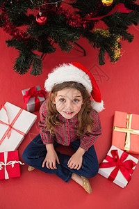 带礼物的节日小姑娘 童年 小玩意儿 圣诞帽 风流 微笑背景图片