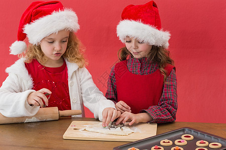 节日小女孩做圣诞节饼干的节日小姑娘 庆祝 姐姐图片