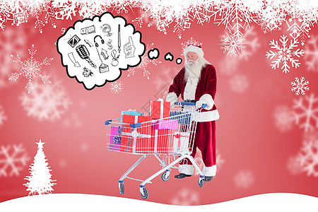 圣诞老人的复合图像推着一辆有礼物的购物车 购买 触摸屏图片
