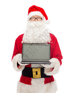 穿着圣塔的装扮的人 用笔记本电脑 广告 庆典背景图片