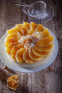 芝士蛋糕装饰着橙子和植物盐 糕点 奶油 假期 刨冰图片