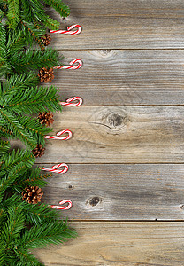 圣诞节边界与生锈的长绿树枝和糖果甘蔗图片