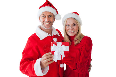 节日情侣微笑和持有礼物 礼物盒 手套 假期 男人 圣诞节图片