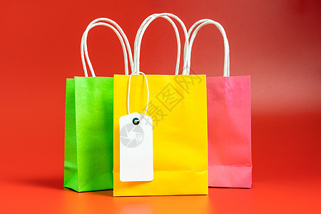 黄色 绿色和粉色购物或礼品袋 红色 购物包 店铺图片