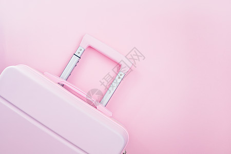 粉红色糊面彩色背景的粉红行李高清图片