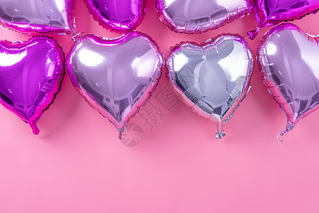 情人节最小设计概念 — 美丽的真心形箔气球隔离在淡粉色背景 顶视图 平躺 摄影上方 派对 婚礼图片