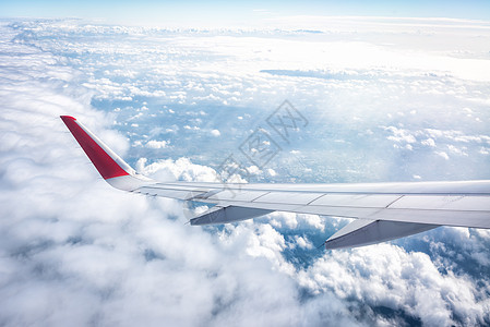 早晨蓝天的飞机机翼之翼玻璃高清图片素材