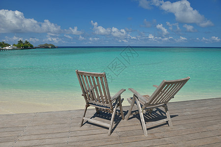 热带热带沙滩椅 蓝色的 泻湖 岛 水 绿松石 异国情调图片
