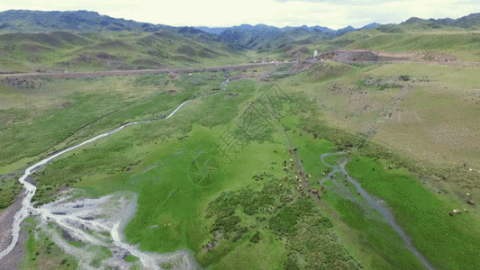 绿色山峰航拍新疆山野山区风景GIF高清图片