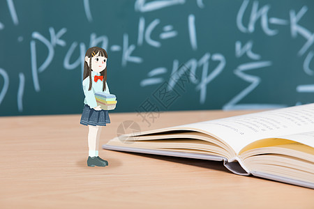 开学季抱书的小女孩背景图片