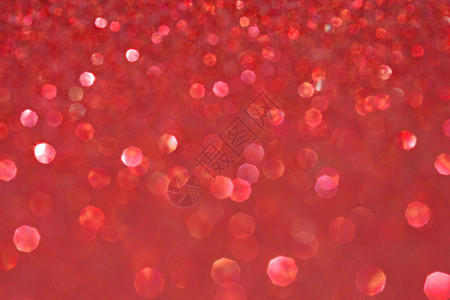 抽象模糊的红色闪光节日背景纹理与闪发光的星全帧洋红色圣诞细节与模糊区域艺术彩色背景背景图片