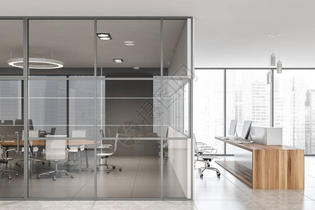 全景国际公司办公室的内部有白色的墙壁瓷砖地板白色和木制的接待台以及左侧的玻璃墙会议室图片