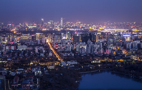 孔雀城夜幕下的京城背景