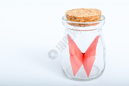 玻璃瓶纸质红色蝴蝶手工艺背景图片