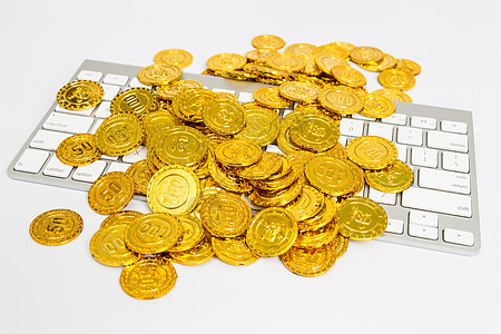 电商商务金色背景金色钱币与电脑键盘背景