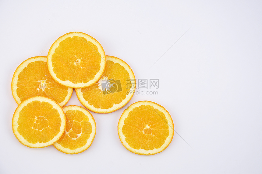 橙子背景水果切片摆拍图片