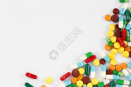 化学物品各种颜色彩色的药片和胶囊背景