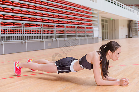羽毛球馆运动健身活力美女平板撑背景