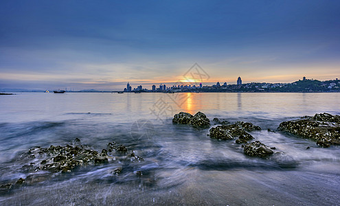 海边夕阳海边城市高清图片