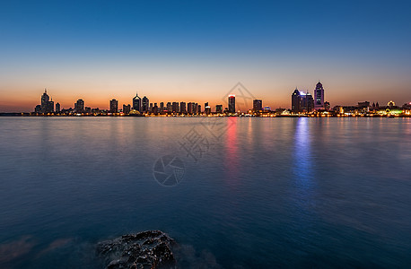 大海落日城市夕阳背景