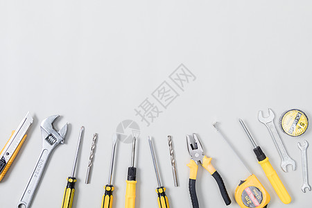 锤子工具整齐排列的各种修理工具背景