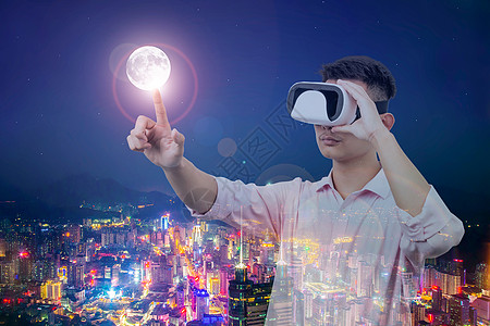 VR虚拟现实，手触城市中的月亮图片
