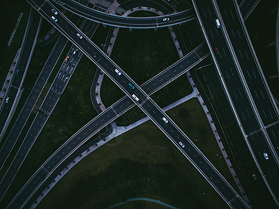 夜景车辆立交桥与城市道路航拍背景