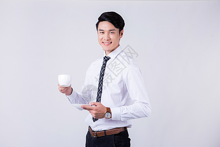 手拿咖啡杯商务男士半身像图片