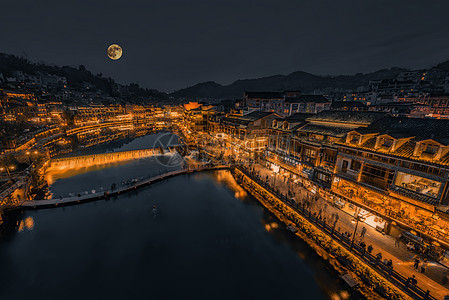 凤凰古城黑金夜景月亮背景图片