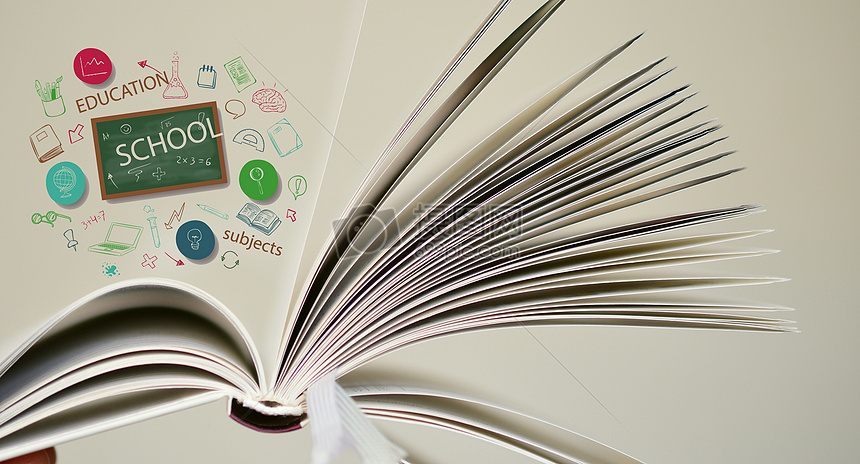 摊开的白色的书本里有各种各样的科学知识摄影