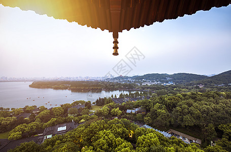 西湖美景雷锋塔上眺望杭州西湖夕阳美景背景