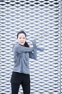 青春女孩户外运动前热身伸展摄影图片免费下载