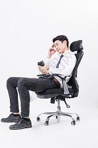疲倦休息思考的商务人喝咖啡背景图片