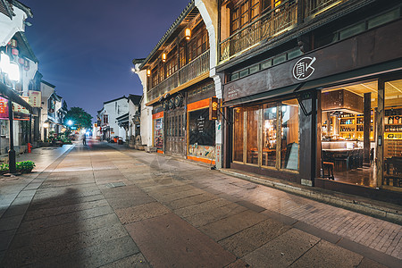 路夜景灯火通明的杭州清河坊街背景