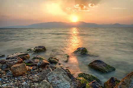 云南旅游展架抚仙湖夕阳背景