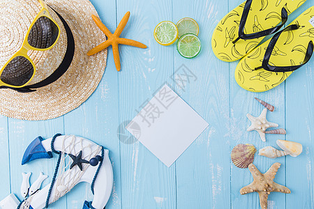 夏日帽子墨镜拖鞋柠檬素材背景图片