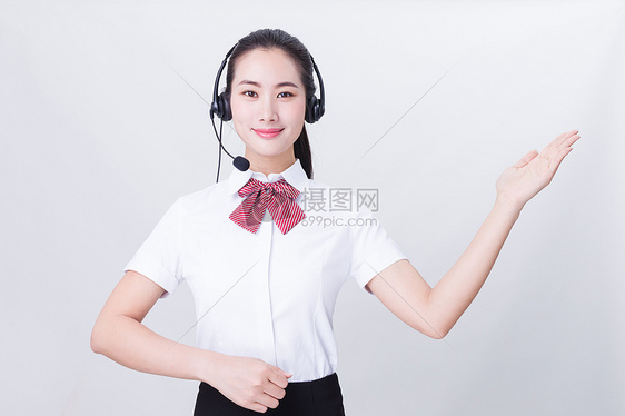 商业亲和力美女客服举手手势图片