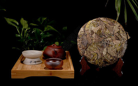茶茶饼和紫砂壶茶叶背景