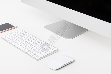鼠标指针摆放整齐简洁的苹果电脑一体机背景
