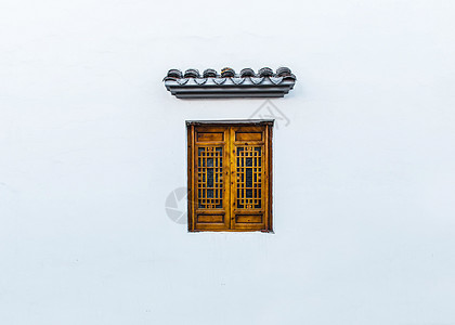古建筑窗户白墙上的古窗背景