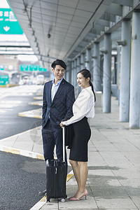 商务男士和商务女士出发到达背景图片