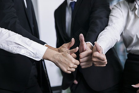 商务团队竖起拇指表达合作成功的信念商业高清图片素材