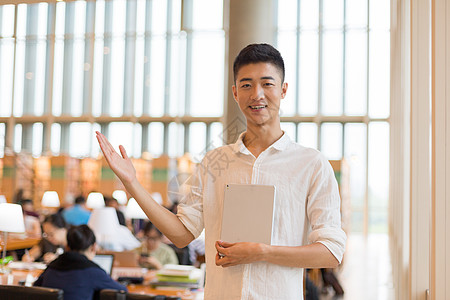 同学图书馆拿着书欢迎大家学习背景图片