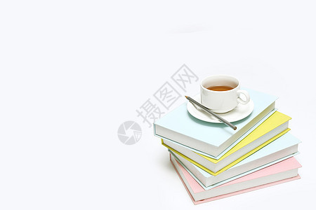 创意书籍和茶杯摆设彩色书籍高清图片素材