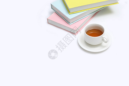 创意书籍茶杯摆拍背景图片