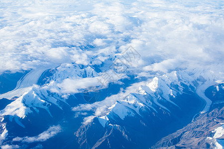 飞机云海雪山云海飞机上航拍仙境云层高空背景