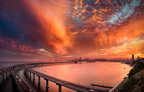 城市建筑跨海大桥夕阳高清图片素材